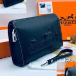 Hermès Black Leather Embossed Wristlet – Classic Luxury Pouch